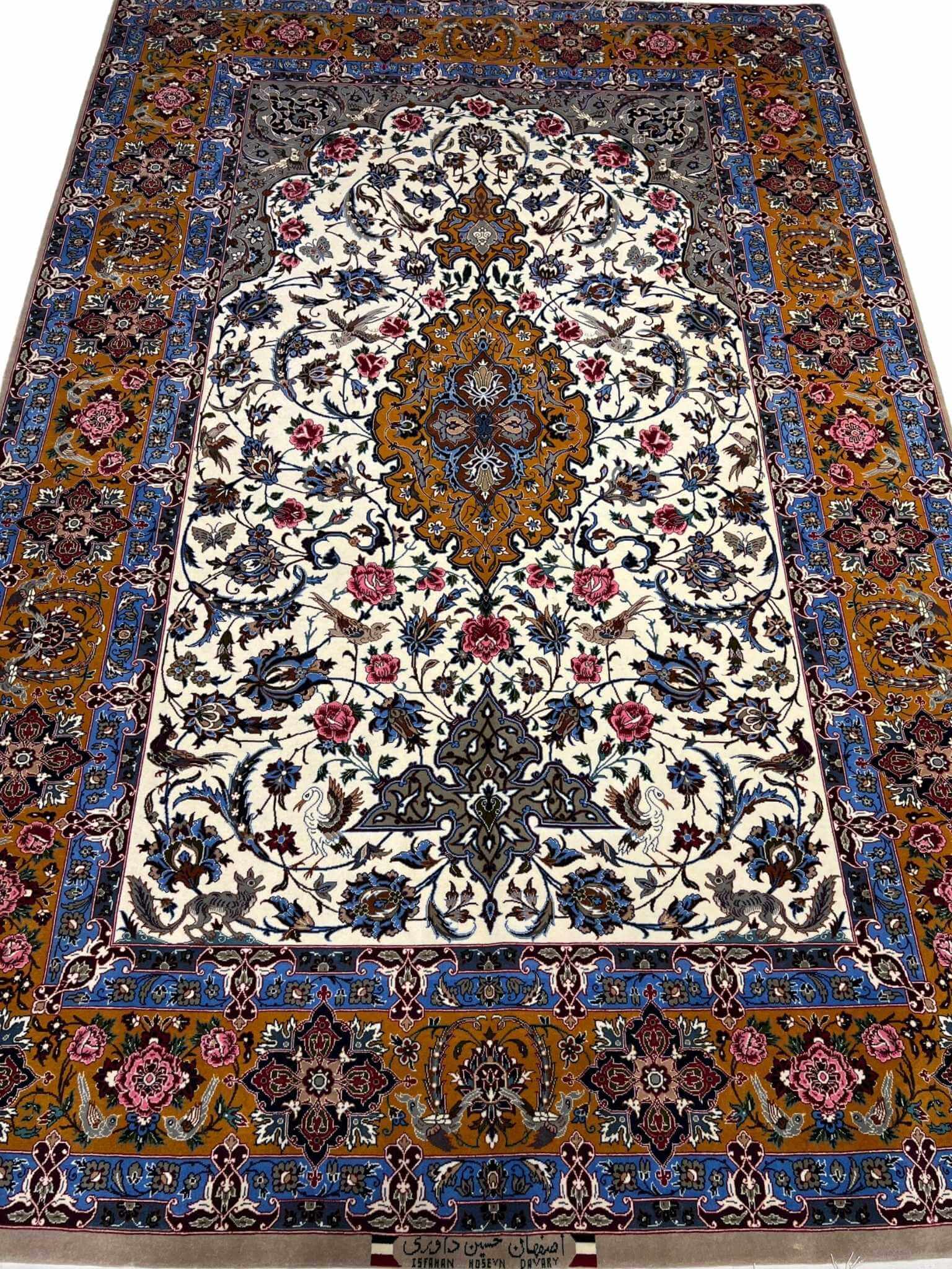 Vintage Isfahan Persian rug with a golden medallion and floral motifs.